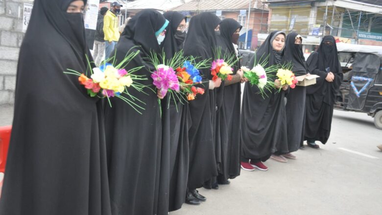 Amid ‘Hijab Ban’, Kashmiri women offer flowers to Hijab-clad students at Kashmir university