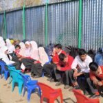 Following fire damage to school building, Kulgam school holds classes in open air