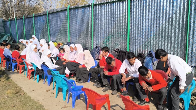 Following fire damage to school building, Kulgam school holds classes in open air